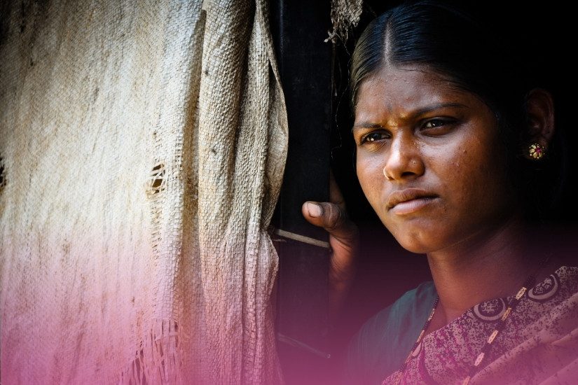 A woman looks outside her home. This is the cover image for the article on apfsd 2026.