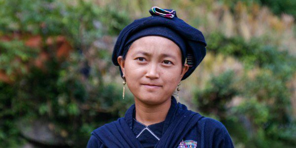 A portrait of a young woman with a neutral expression looking slightly off-camera.